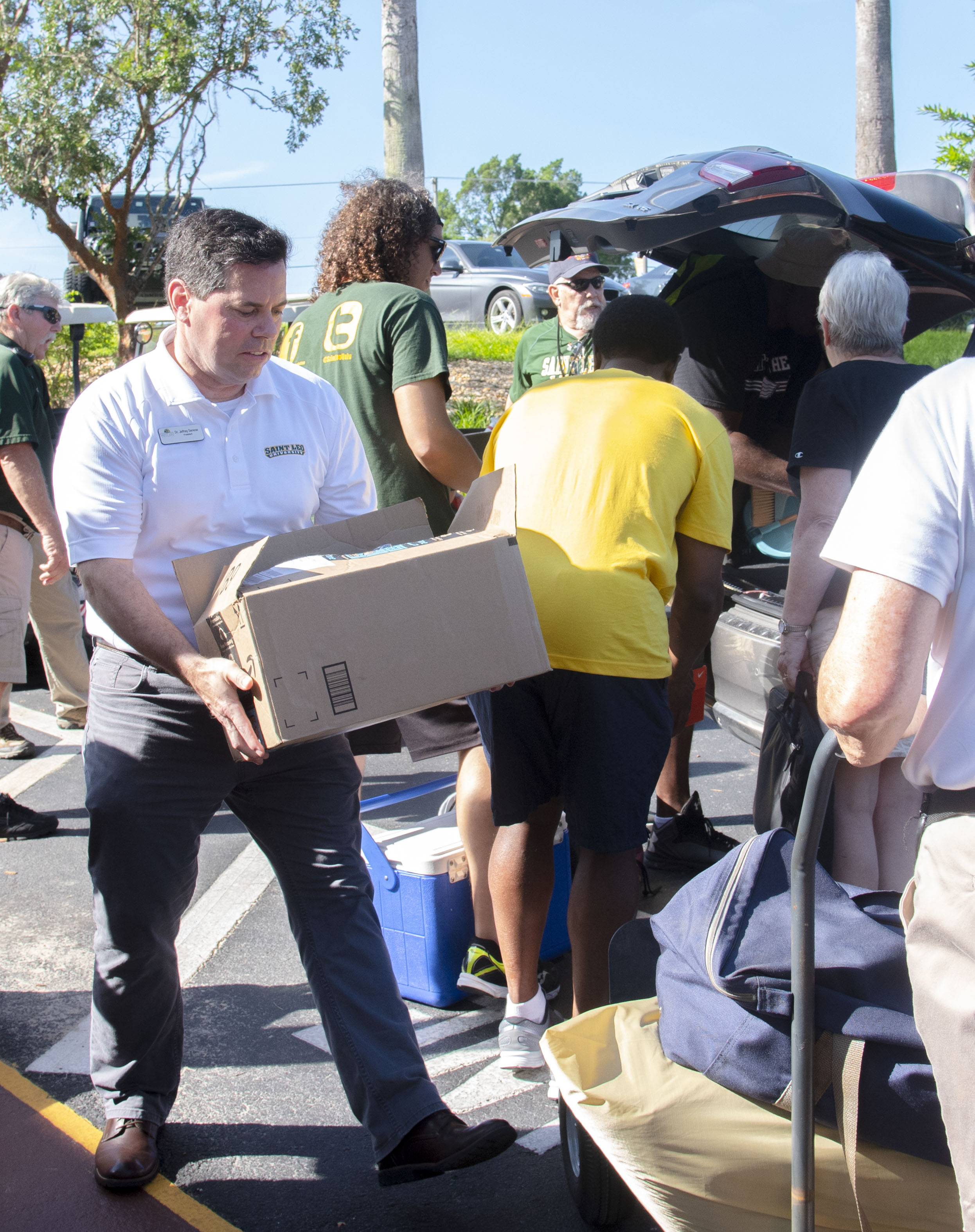 Dr. Jeffrey Senese carrying boxes